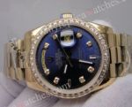 Rolex Gold DayDate Watch Diamond Bezel Blue Face_th.jpg